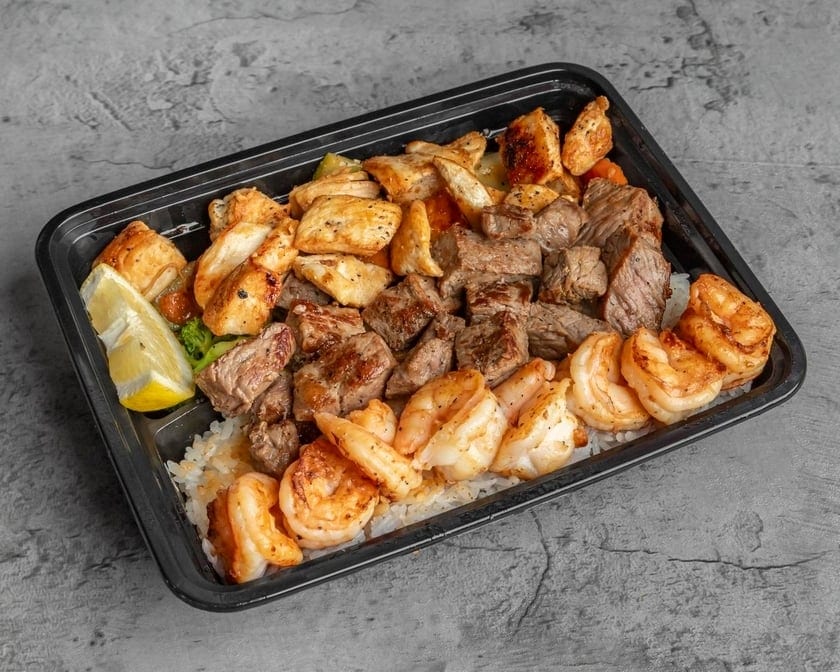 New York Steak, Chicken, & Shrimp Trio Combination Plate.